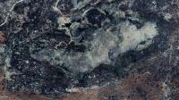 Vista aérea do Geossítio Lajedo do Pai Mateus. Observa-se que o mesmo constitui uma feição de relevo do tipo "Dorso de Baleia / Whaleback". Fonte: Google Earth, imagem capturada em  21/09/2018.